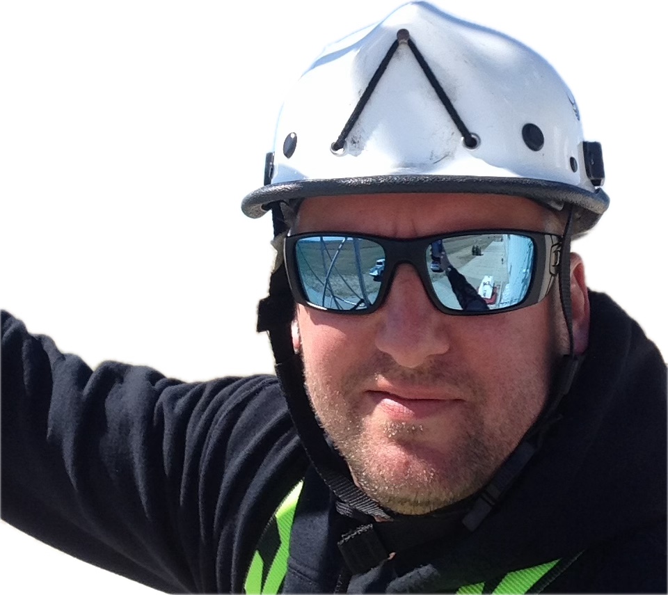 Robert Plummer, EGIS owner and lead instructor, wearing a climbing helmet and safety harness